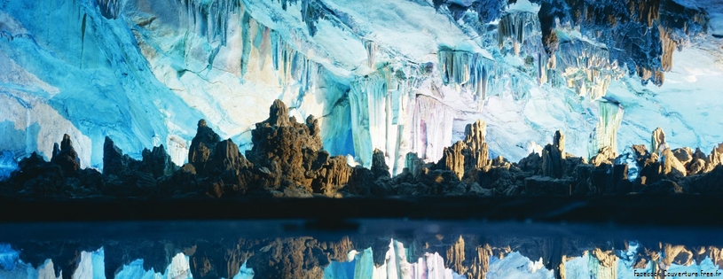 Stalactites and Stalagmites Reflected in Reed Flute Cave, Guilin, China.jpg